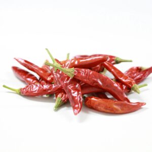 A vibrant collection of red chili peppers arranged on a white background, showcasing their fiery color.