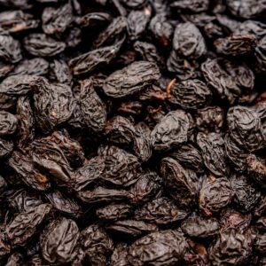 High-quality close-up image of a pile of dried raisins perfect for health-focused content.