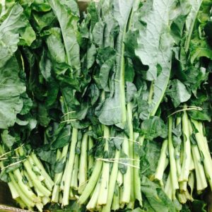 Vibrant fresh green leafy vegetables on display, showcasing organic produce.